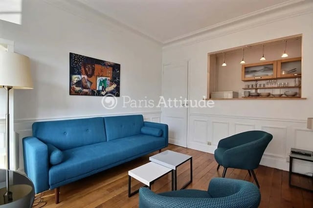 Blue sofa kitchen open living room at Apartment in Cité Voltaire, 75011 Paris, France in Paris Student Accommodation
