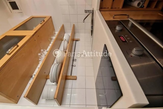 Cabinets sink stove dishes glasses kitchen area at Apartment in Cité Voltaire, 75011 Paris, France in Paris Student Accommodation