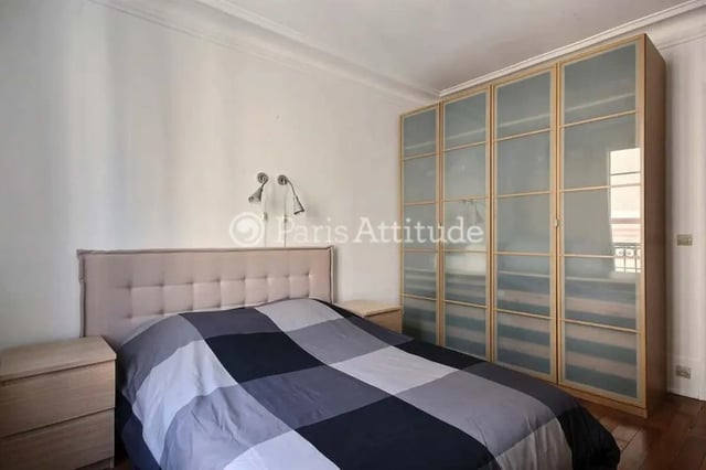 Bed bedside tables large wardrobe bedroom at Apartment in Cité Voltaire, 75011 Paris, France in Paris Student Accommodation