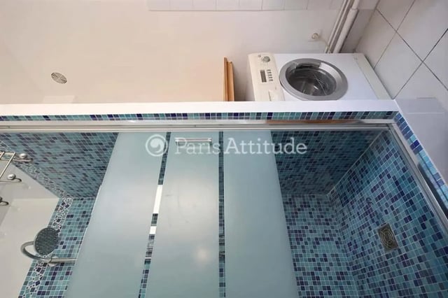 Shower stall with mosaic tiles and washing machine Bathroom at Apartment in Cité Voltaire, 75011 Paris, France in Paris Student Accommodation