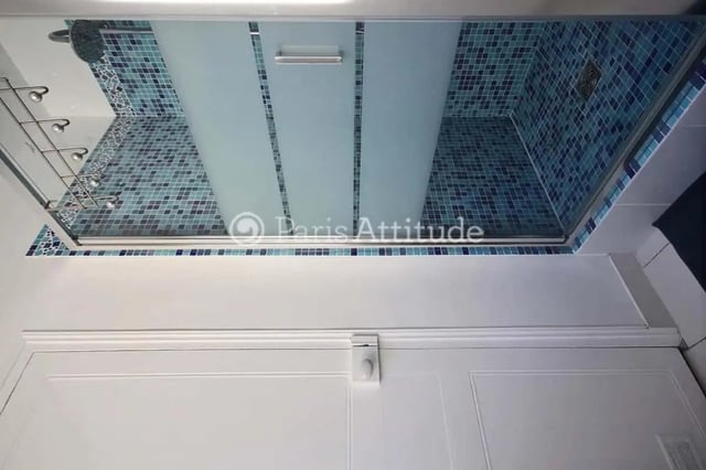 Shower stall with blue mosaic tile and frosted glass Bathroom at Apartment in Cité Voltaire, 75011 Paris, France in Paris Student Accommodation