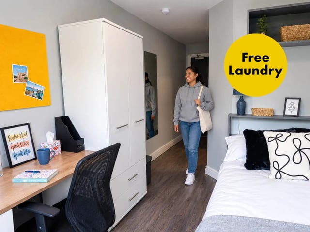 Desk wardrobe bed and person bedroom at City Edge - Manchester in Manchester Student Accommodation