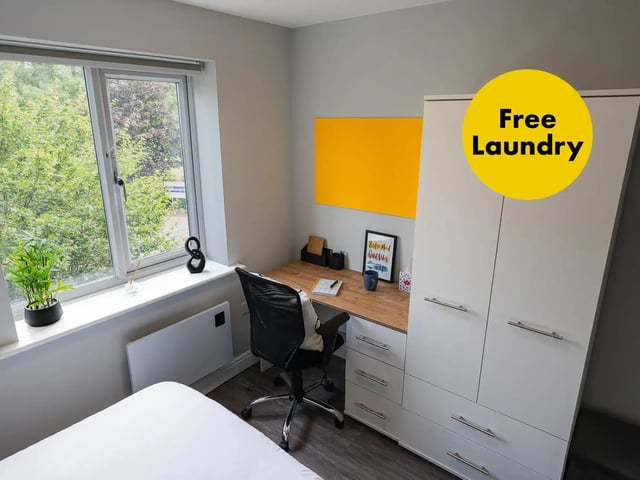 Desk chair wardrobe and bed study area at Moss Court in Manchester Student Accommodation