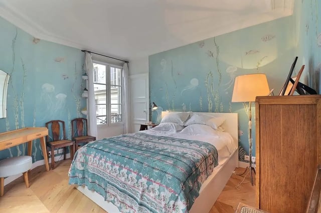 Bed with sea creature wallpaper and desk bedroom at Apartment in Rue Clauzel, 75009 Paris, France in Paris Student Accommodation