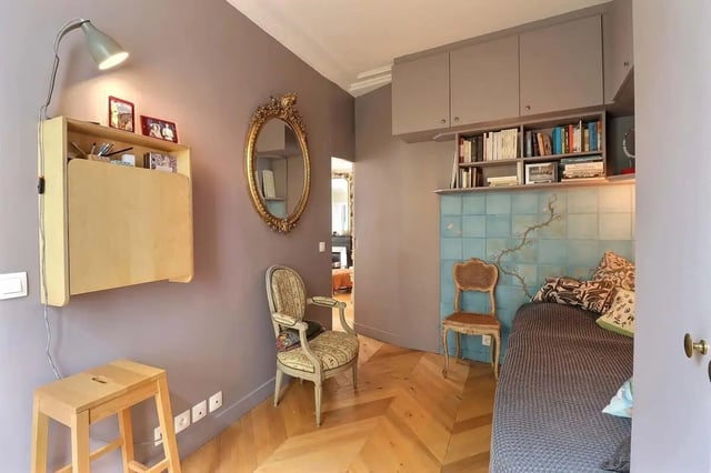 Desk shelf lamp mirror bed and chairs bedroom at Apartment in Rue Clauzel, 75009 Paris, France in Paris Student Accommodation