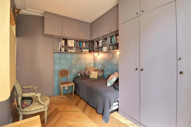 Bed with pillows, chairs, bookshelves, wardrobe bedroom at Apartment in Rue Clauzel, 75009 Paris, France in Paris Student Accommodation