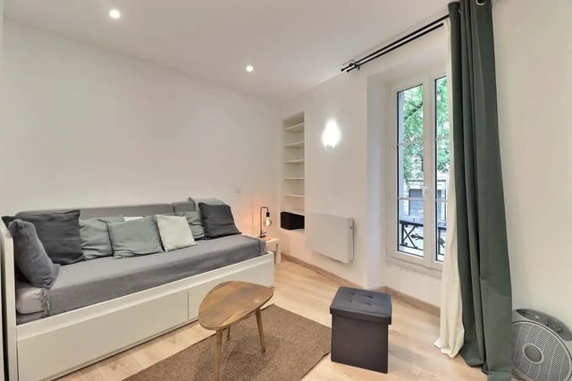 Sofa with pillows small table storage ottoman living room at Studio in Av. Félix Faure, 75015 Paris, France in Paris Student Accommodation