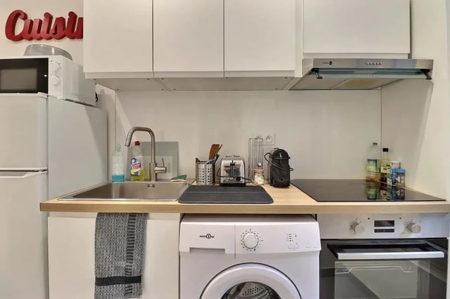 Sink microwave toaster washing machine stove kitchen at Studio in Av. Félix Faure, 75015 Paris, France in Paris Student Accommodation