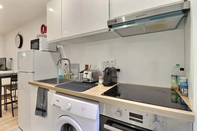 Fridge sink washing machine toaster espresso machine kitchen at Studio in Av. Félix Faure, 75015 Paris, France in Paris Student Accommodation