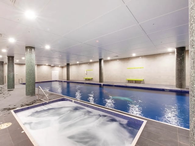Indoor pool and jacuzzi area with benches at Belong Eastgardens in Sydney Student Accommodation