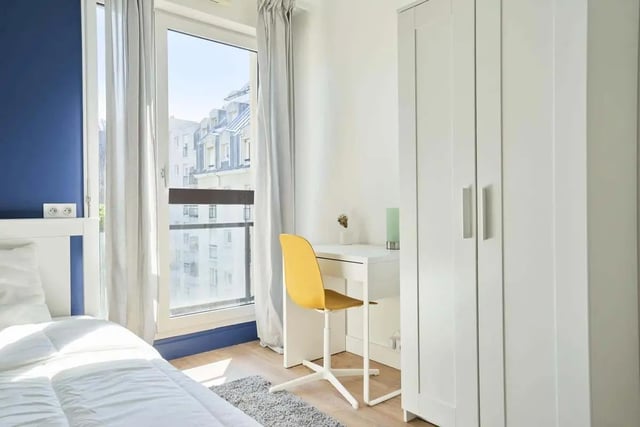 Bed desk chair wardrobe bedroom. at Room in 121 Rue Haxo, 75019 Paris, France in Paris Student Accommodation