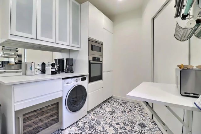 Washer coffee maker oven wine fridge kitchen at Apartment in Rue Villaret de Joyeuse, 75017 Paris, France in Paris Student Accommodation