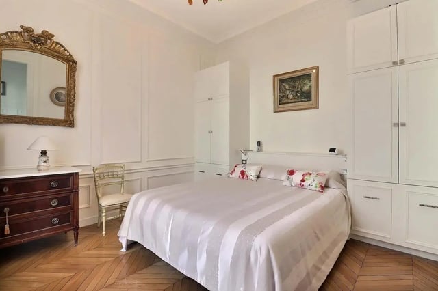 Bed dresser mirror and wardrobes bedroom at Apartment in Rue Villaret de Joyeuse, 75017 Paris, France in Paris Student Accommodation