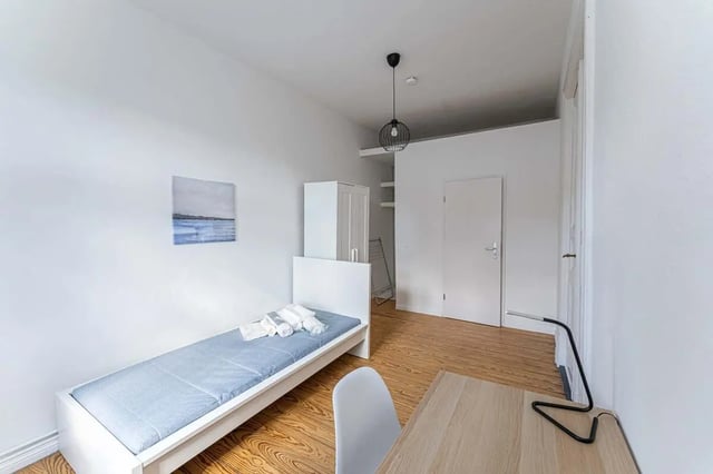 Bed with linens and towels wardrobe desk lamp bedroom at Gabriel-Max-Straße - Room 4 in Berlin Student Accommodation