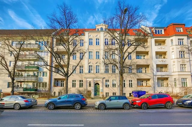 Apartment building with balconies cars and trees exterior at Hohenzollerndamm 53.6 in Berlin Student Accommodation