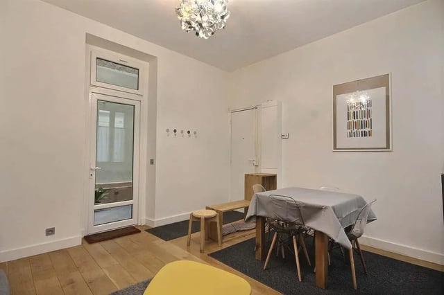 Table chairs bench coat rack living room at Apartment 1 bedroom 41m² in Paris Student Accommodation