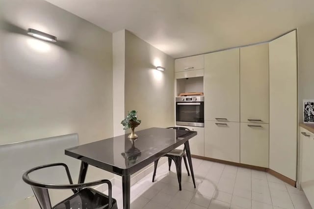 Table chairs oven cabinets kitchen at Apartment in Rue Saint-Honoré, 75001 Paris, France in Paris Student Accommodation