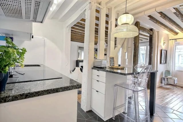 Kitchen counter with toaster and clear stools kitchen at Apartment 1 bedroom 60m² in Paris Student Accommodation