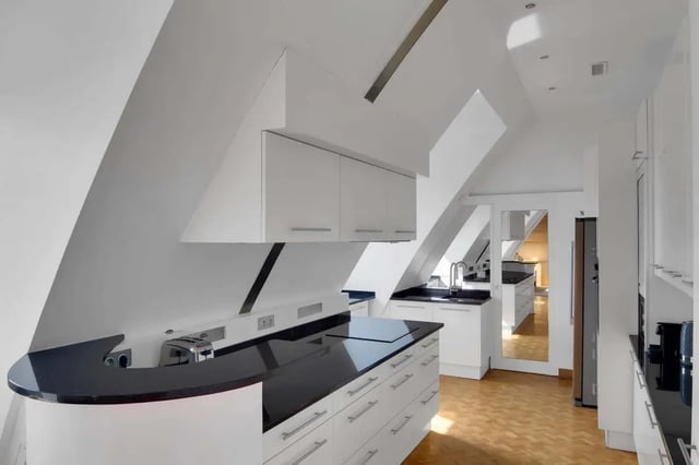 Modern kitchen with white cabinets black countertops kitchen at Rue de Bretagne in Paris Student Accommodation