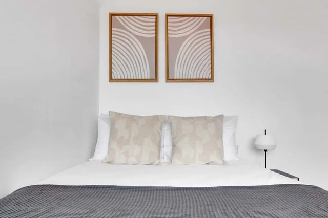 Bed with art pillows and lamp bedroom at Rue de Bretagne in Paris Student Accommodation