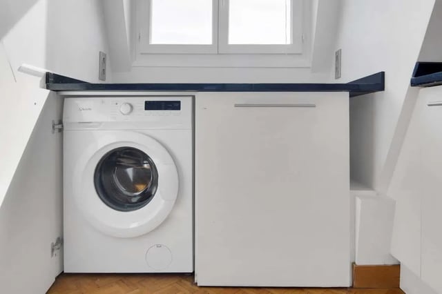 Washing machine and cabinet under window kitchen at Rue de Bretagne in Paris Student Accommodation