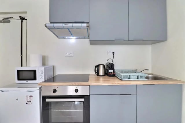 Compact kitchen with microwave kettle and sink Kitchen at Apartment in Rue Sedaine, Paris for 37 m² with 1 bedroom in Paris Student Accommodation