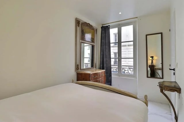 Bed chest of drawers window mirror bedroom at Apartment in Rue Sedaine, Paris for 37 m² with 1 bedroom in Paris Student Accommodation