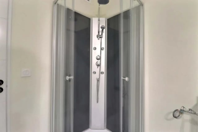 Shower column with multiple jets and showerhead Bathroom at Apartment in Rue Sedaine, Paris for 37 m² with 1 bedroom in Paris Student Accommodation