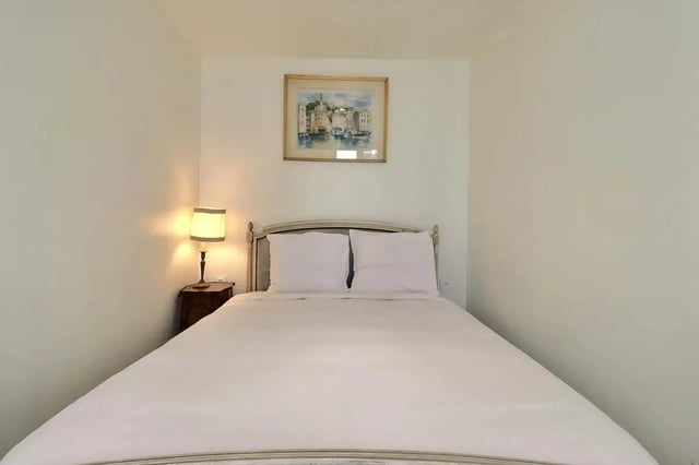 Bed with white linens lamp and painting bedroom at Apartment in Rue Sedaine, Paris for 37 m² with 1 bedroom in Paris Student Accommodation