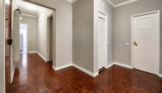 Hallway with wooden floor and doors Interior at Casa Abel II – Room 5 in Lisbon Student Accommodation