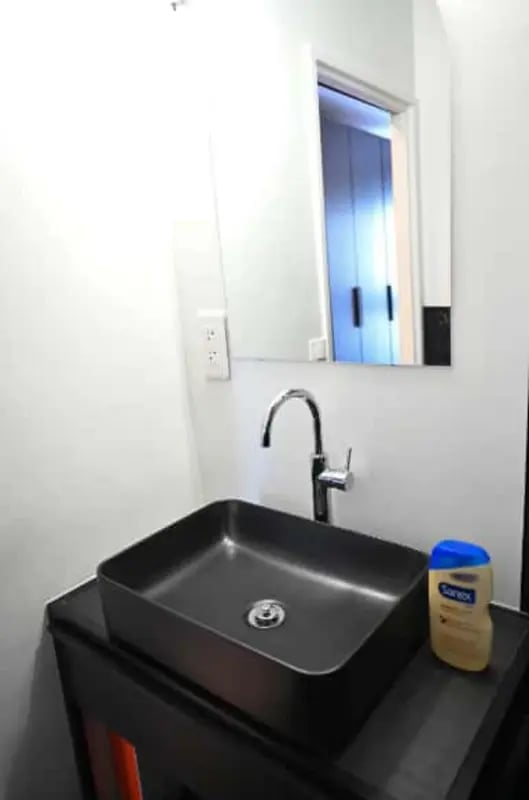 Black vessel sink with chrome faucet bathroom. at Splendide grand studio parking Canal Saint Martin (Paris) in Paris Student Accommodation