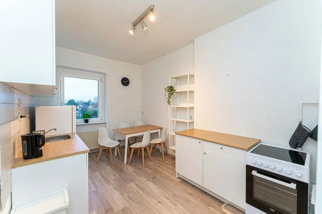 Table chairs kettle sink oven kitchen. at Sterndamm 75.2 75.3 in Berlin Student Accommodation