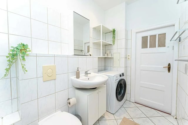 Sink toilet washing machine shelf bathroom at Sterndamm 75.2 75.3 in Berlin Student Accommodation