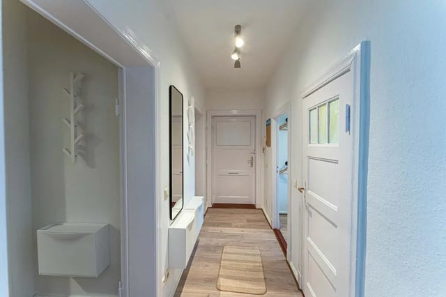 Hallway with coat rack mirror and mat hallway at Sterndamm 75.2 75.3 in Berlin Student Accommodation