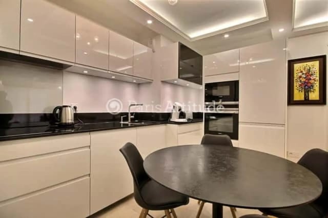 Modern kitchen with dining table and chairs kitchen at Apartment in Rue de Clichy, 75009 Paris, France in Paris Student Accommodation