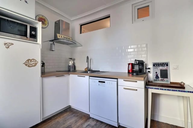 White cabinets microwave dishwasher coffee machine kitchen at Apartment 2 bedrooms 63m² in Paris Student Accommodation