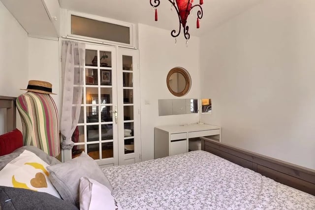 Bed dresser mirrored vanity and door bedroom at Apartment 2 bedrooms 63m² in Paris Student Accommodation