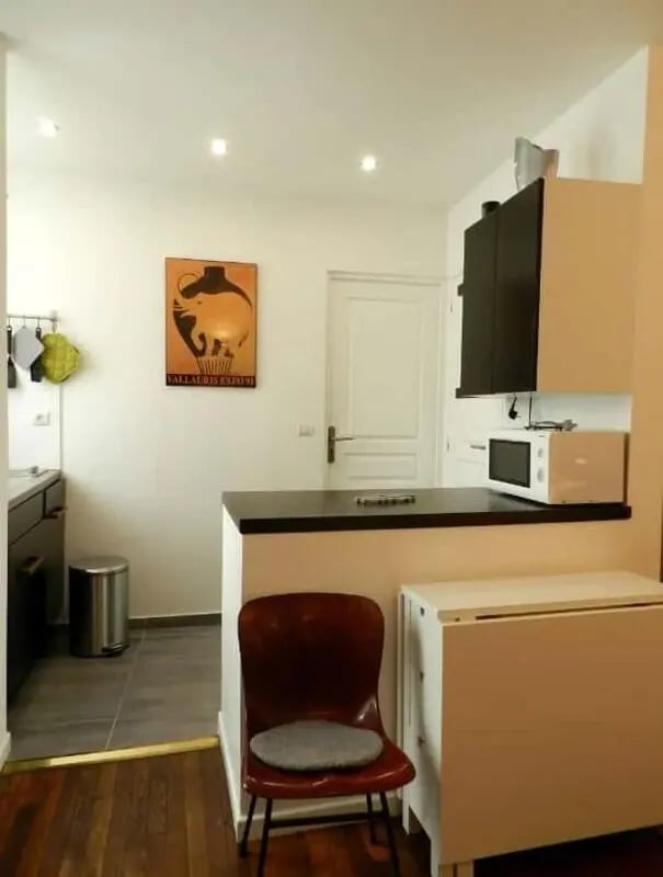 Kitchen counter chair microwave folding table kitchen at Apartment 1 bedroom 28m² in Paris Student Accommodation