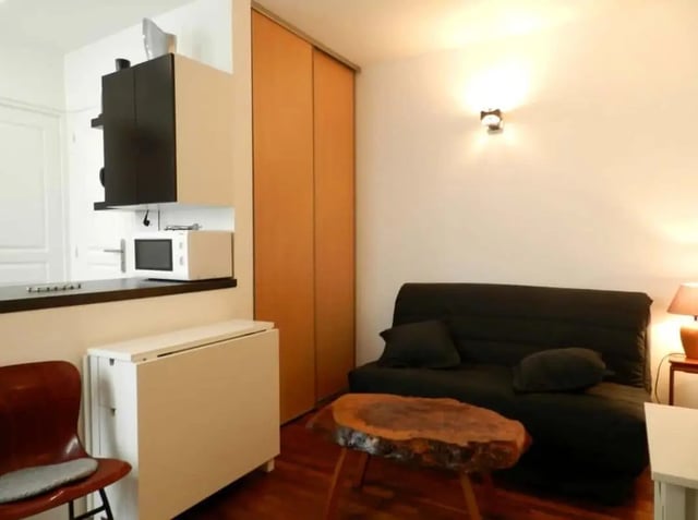 Kitchenette sofa table and chair living room at Apartment 1 bedroom 28m² in Paris Student Accommodation