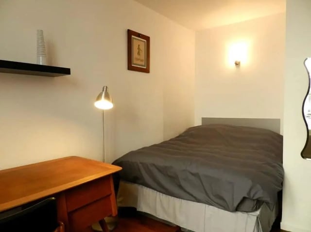 Desk lamp bed and framed picture Bedroom at Apartment 1 bedroom 28m² in Paris Student Accommodation