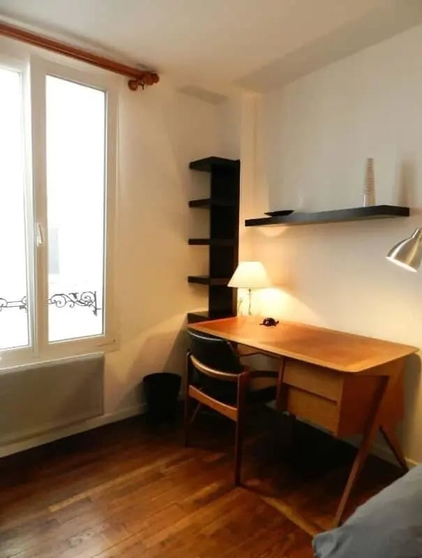 Desk chair shelves lamp and window study area at Apartment 1 bedroom 28m² in Paris Student Accommodation