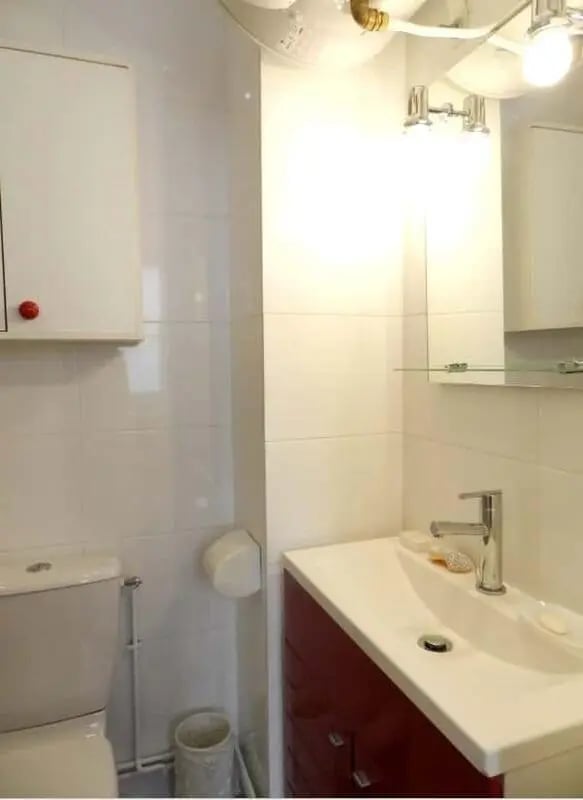 Toilet sink cabinet and mirror bathroom at Apartment 1 bedroom 28m² in Paris Student Accommodation