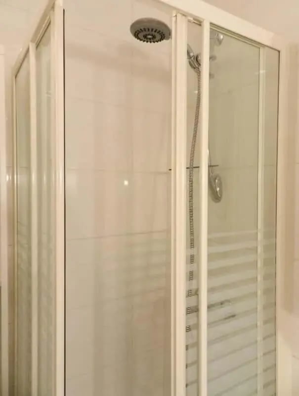 Shower stall with chrome shower head and sliding doors Bathroom at Apartment 1 bedroom 28m² in Paris Student Accommodation