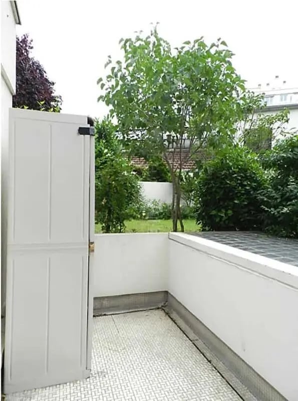 White storage cabinet green trees garden exterior at Studio in Rue Mademoiselle, 75015 Paris, France in Paris Student Accommodation