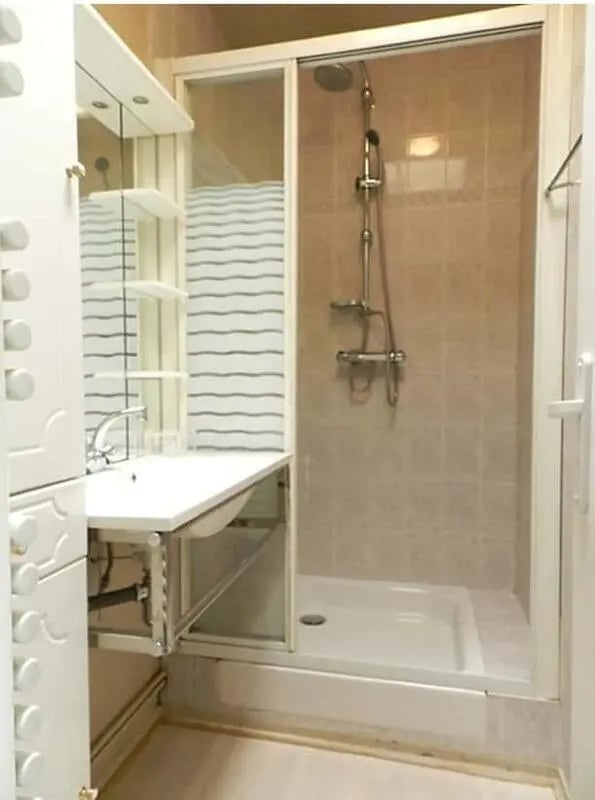 Sink shower shelving storage white bathroom at Studio in Rue Mademoiselle, 75015 Paris, France in Paris Student Accommodation