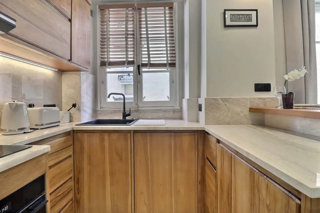 Modern kitchen with wood cabinets and appliances kitchen at Apartment Studio 38m² in Paris Student Accommodation