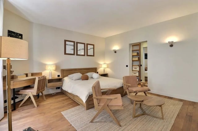 Bed desk chairs and coffee table bedroom at Apartment Studio 38m² in Paris Student Accommodation