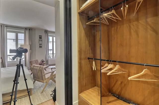 Wooden wardrobe with empty hangers Bedroom at Apartment Studio 38m² in Paris Student Accommodation