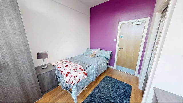 Bed closet lamp bedside table bedroom at Haigh Court in Liverpool Student Accommodation