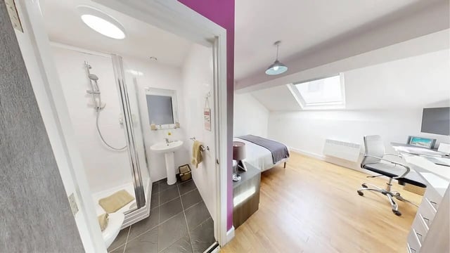 Shower sink and toilet adjacent to bed study desk bedroom bathroom at Haigh Court in Liverpool Student Accommodation